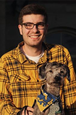 man smiling with dog